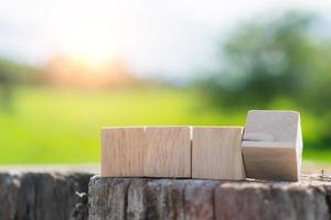 In a hand-held background, a blank wooden cube can be used to add text. photo