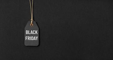 Black friday tag isolated on black background with copy space photo