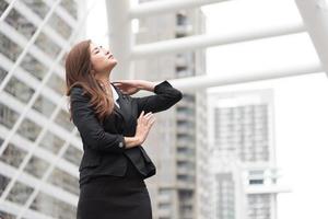 Business woman look up and flick her hair at outdoor. Business and Beauty concept photo