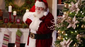 Santa Claus waves and says Merry Christmas video