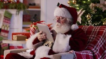 Santa Claus using digital tablet video