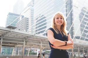 Portrait of happy business woman looking confident. People and lifestyles concept. Outdoors theme. photo