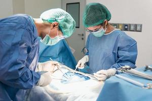 Doctor and assistant nurse operating for rescue patient from dangerous emergency case. Hospital and Surgery Concept. Health care and Medical concept. Cancer and disease treatment photo