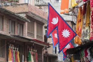 Red, blue flag of Nepal in middle of Kathmandu, Nepal. photo