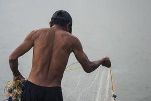 Sorong, Indonesia 2021- Pond fishermen photo