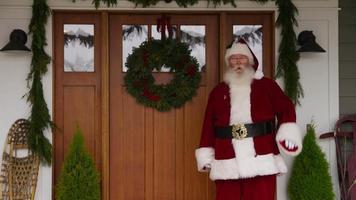 Santa Claus waving by front door video