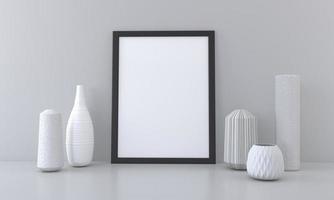 un marco de imagen en blanco y jarrones sobre una mesa foto