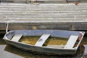 Wooden boats near a dock in the harbor photo