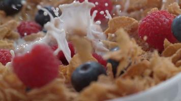 Closeup of raspberries splashing into bowl of cereal in slow motion, shot on Phantom Flex 4K at 1000 fps video