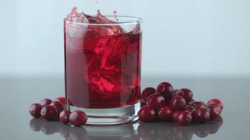 Ice splashing into cranberry juice in slow motion. shot on Phantom Flex 4K at 1000 fps video