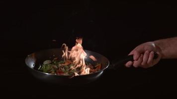 Flaming stir-fry in slow motion. shot on Phantom Flex 4K at 1000 fps