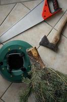 Hammer And Saw. Christmas Tree Stand. Festive Preparation. photo