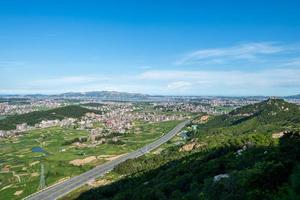 The mountain overlooks the rich villages and towns photo