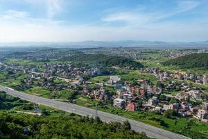 The mountain overlooks the rich villages and towns photo