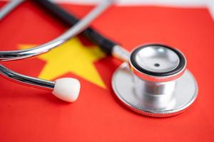 Stethoscope on China flag, check problem of business and finance concept photo