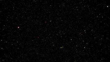 Animación de estrellas de partículas brillantes brillantes sobre fondo negro