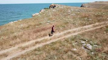 Aerial view. Man is running along general's beaches, Autumn in Crimea