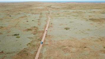 Aerial view. Cars go across the field. General's beaches, Crimea video