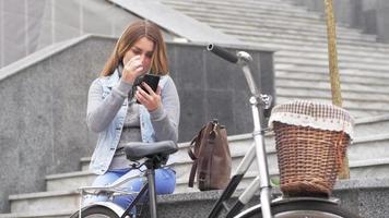 Young woman with retro bicycle outdoors video