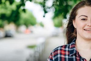 Young, beautiful woman posing, looking straight into the camera photo