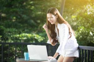 Asian business woman arms up for Celebration Success Working ,Successful Concept photo