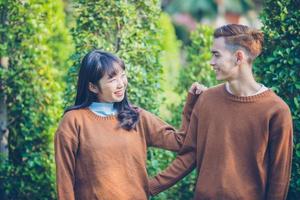 Beautiful young couple is looking Smiling happy in love outdoors photo