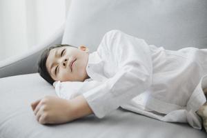 happy bedtime Child sleeping on sofa photo