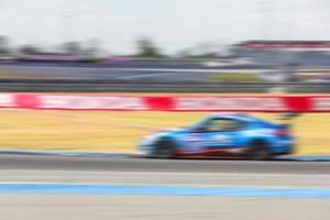 car racing on the road and track with motion blur and Radial blur photo