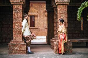 Asian bride and Caucasian groom have romantic time with Thailand dress photo