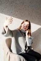 Portrait of a beautiful young woman with a shadow pattern on the face and body photo