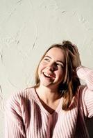 Portrait of a beautiful young woman with a shadow pattern on the face and body photo