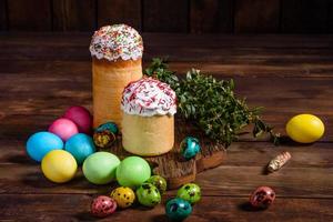 Easter cake and colorful eggs on a dark background photo