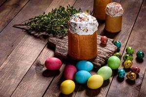 Easter cake and colorful eggs on a dark background photo