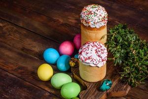 Easter cake and colorful eggs on a dark background photo