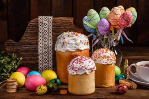 Easter cake and colorful eggs on a dark background photo