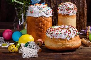 Easter cake and colorful eggs on a dark background photo