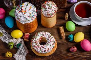 Easter cake and colorful eggs on a dark background photo