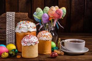 Easter cake and colorful eggs on a dark background photo