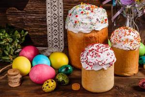 Easter cake and colorful eggs on a dark background photo