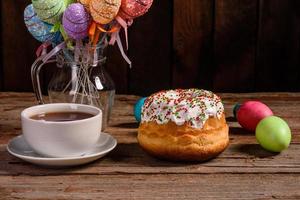 Easter cake and colorful eggs on a dark background photo