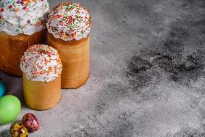 Easter cake and colorful eggs on a dark background photo