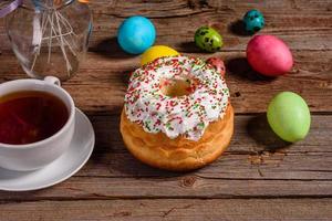 Easter cake and colorful eggs on a dark background photo