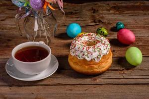 Easter cake and colorful eggs on a dark background photo