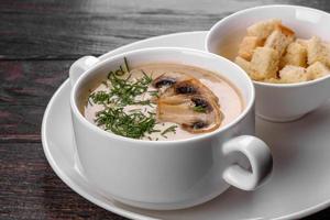 Cream of mushroom soup. Home-made with whole and sliced mushrooms photo