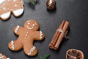 Christmas festive gingerbread made at home on a dark table photo