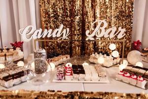 Delicious sweet buffet with cupcakes. Sweet holiday buffet with cupcakes and other desserts. Candy Bar. photo