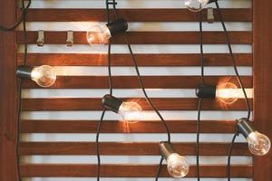 Light bulbs on Wooden Background photo