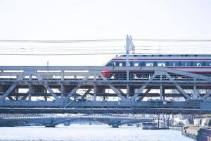 Tokyo City Train running on the Bridge over Sumida River photo