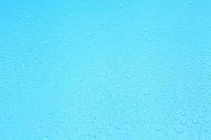 Water drops on blue background with a blank space for a text photo