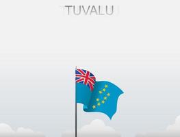 The Tuvalu flag is flying on a pole that stands tall under the white sky vector